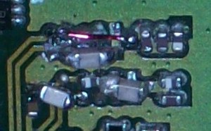 Closeup of the hacked-up capacitors